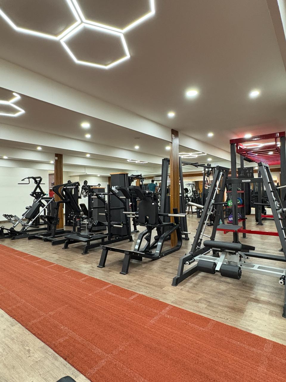 Inside Liger Fitness Vellimadukunnu - training area and premium equipment